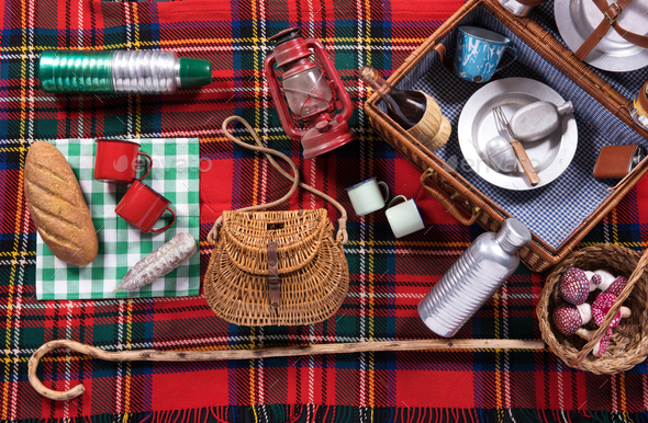 Assortment of picnic tools on a tartan rug Stock Photo by Photology75