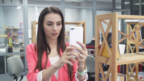 Young Woman taking Selfie Photos in Office