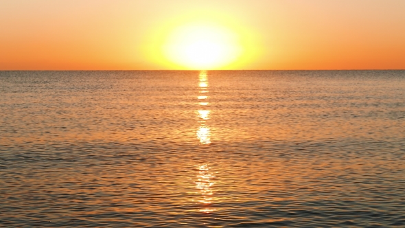 Sun Rising Over the Calm Sea