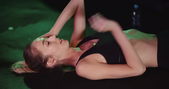 Athletic Female Actively Exercising at Gym. alt