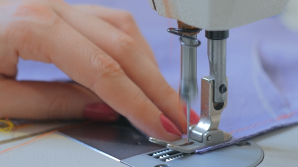 Professional Tailor, Fashion Designer Sewing Clothes with Sewing Machine