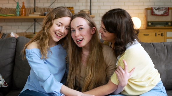 Three Best Female Friends Have Fun Sitting at Home