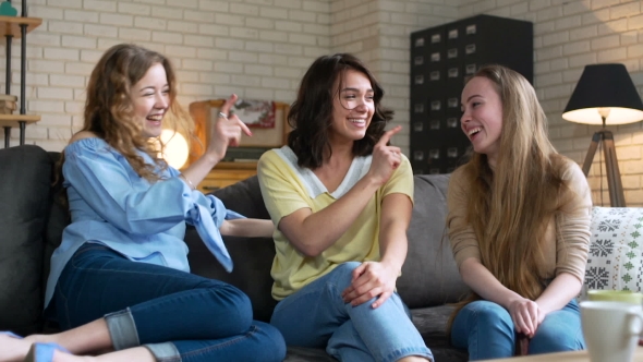 Three Best Female Friends Have Fun Sitting at Home