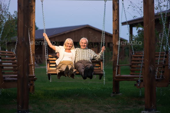 Elderly couple on porch swing