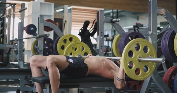 Young Athlete Is Doing Bench Press alt