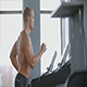 Muscular Man Running On A Treadmill In The Gym Muscular Man Running On A Treadmill In The Gym - VideoHive Item for Sale