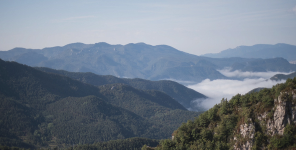 Clouds under mountains