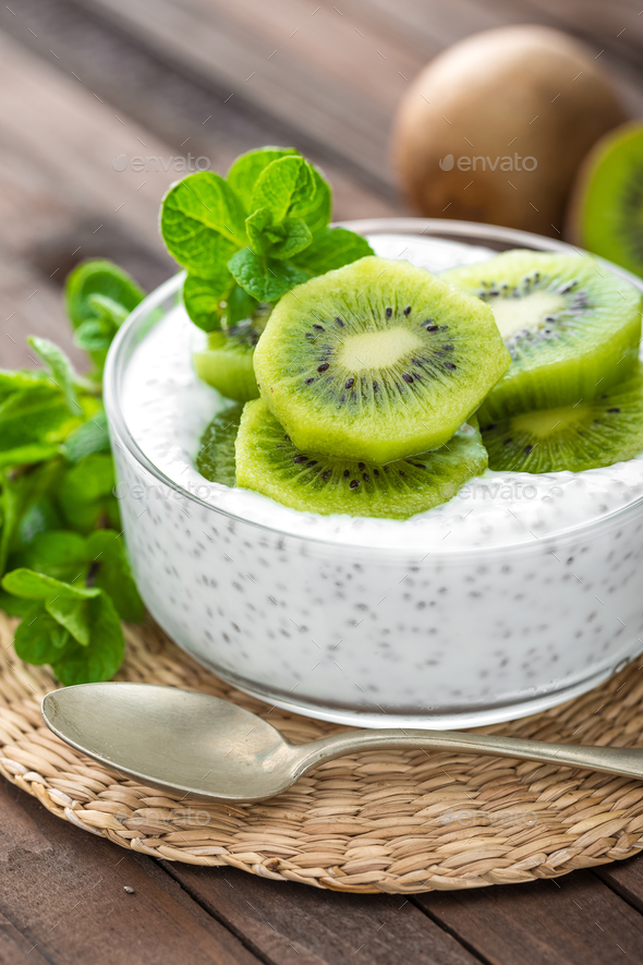 Fresh kiwi yogurt with fruits and chia seeds, healthy breakfast Stock Photo by sea_wave
