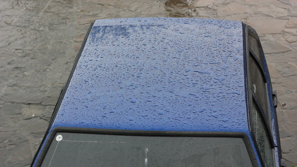 Car Under Rain In The Street