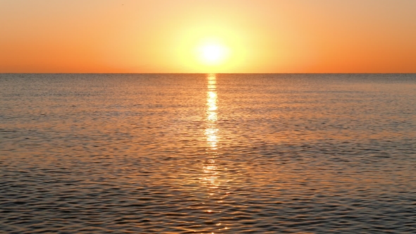 Sun Rising Over the Calm Sea