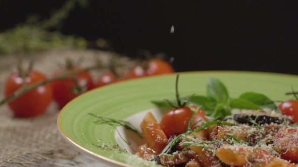 Falling Cheese on a Penne Pasta with Cherry Tomatoes
