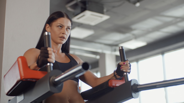 Young Brunette Girl Doing Press-ups At The Gym alt