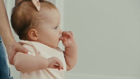 Dad Helps His Little Daughter To Take the First Steps