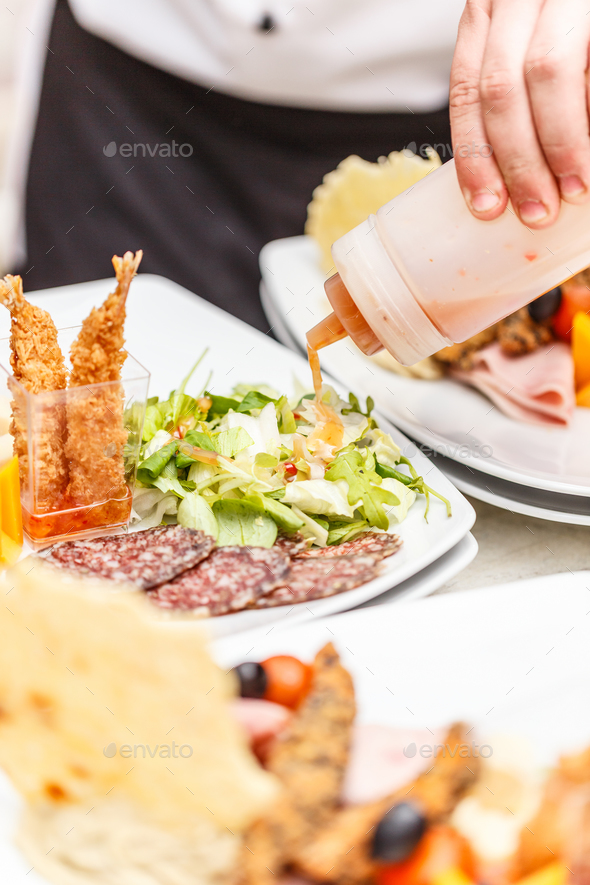 Chef is garnishing appetizer dish - Stock Photo - Images