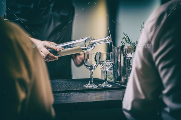 Bartender serving alcohol drinks Stock Photo by grafvision | PhotoDune