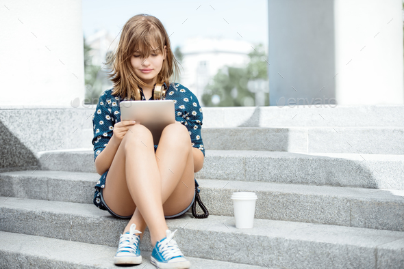 Reading on tablet. - Stock Photo - Images