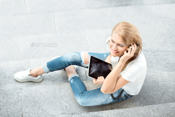 Studying on stairs. - Stock Photo - Images