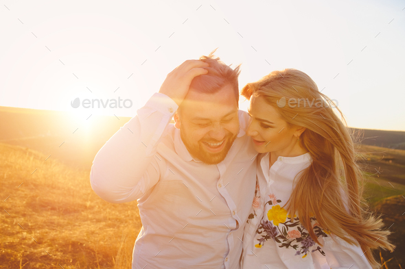 Young couple embracing and kissing outdoor - Stock Photo - Images
