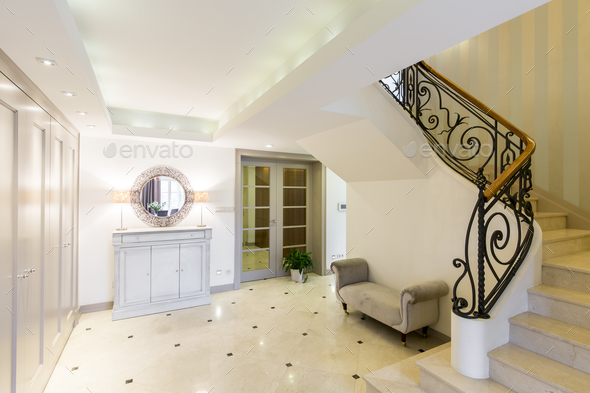 Elegant hallway with a stylish staircase