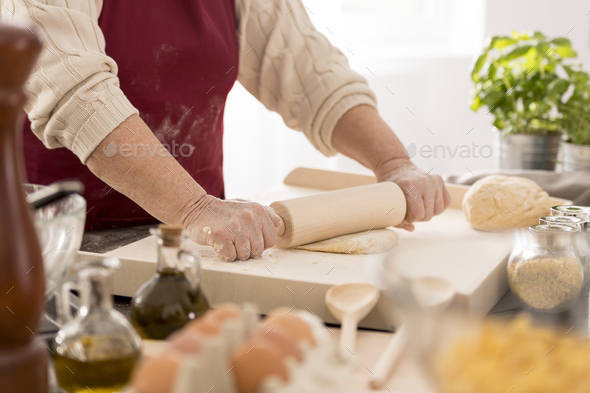 Woman rolling the dough - Stock Photo - Images