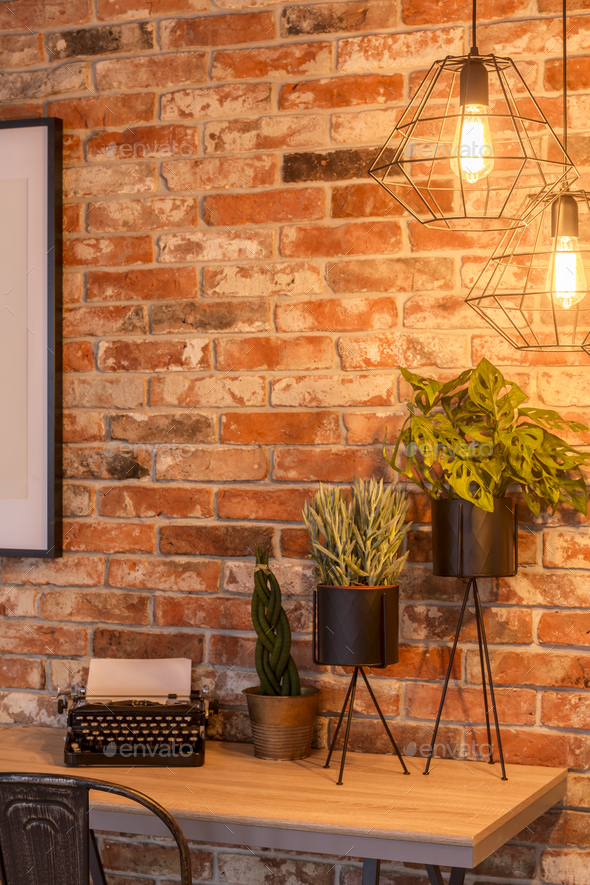 Home office with brick wall