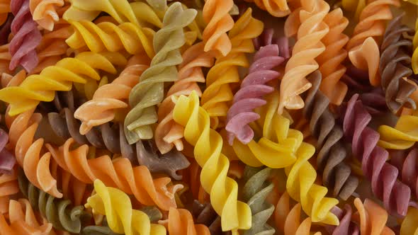 Colored italian fusilli raw pasta alt