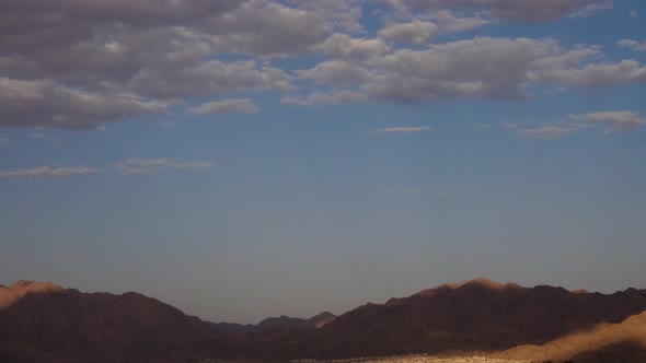 cloud moving, Eilat city ,desert, city, mountains, hotels ,at night, fast motion