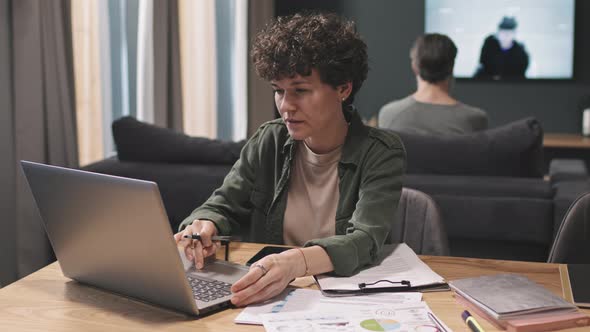 Modern Woman Working On Laptop From Home alt