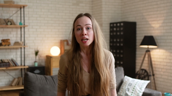 POV View at Young Blonde Enraged Woman Shouting with Anger and Crying