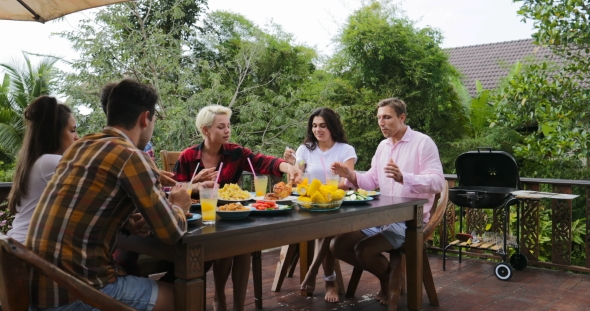 Couple Telling Toast Standing Up People Eating On Terrace Young Friends Sitting At Table Outdoors alt