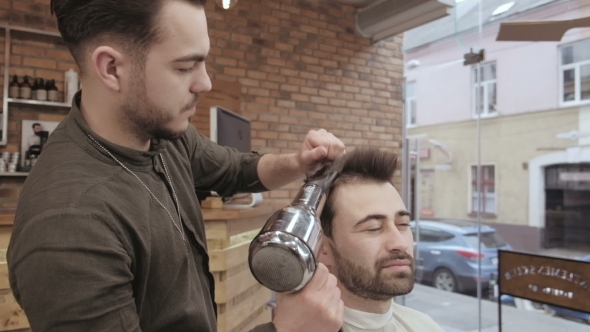 VideoHive Skillful Barber Drying Male Hair at Barbershop 19922977 VideoHive Skillful Barber Drying Male Hair at Barbershop 19922977