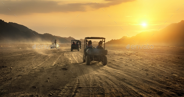 Buggy riding in desert - Stock Photo - Images