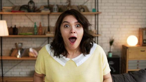 Young Active Woman Is Amazed and Shocked By Exiting News
