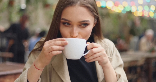 Gentle Female Drinking Coffee alt