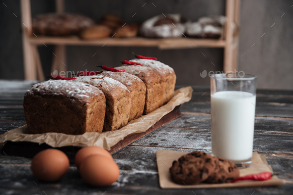 Bread with milk and cookie near eggs - Stock Photo - Images