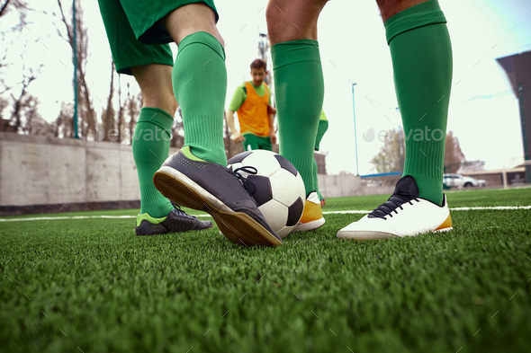 Thq legs of soccer football player - Stock Photo - Images