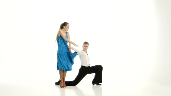 Pair of Graceful Dancers Perform Tango on White Studio Background alt