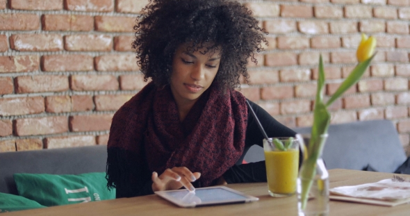 African Girl Using Table in Cafe alt
