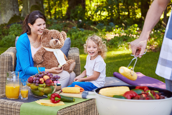 Family having grilled food - Stock Photo - Images