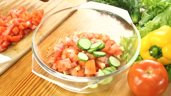 Chopped Red Tomato Falling Into Bowl