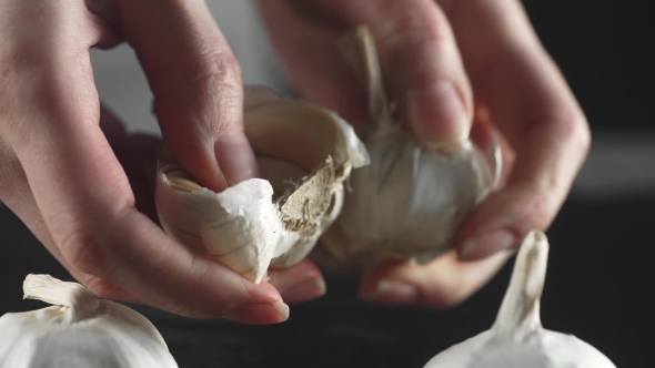 Housewife Breaks the Cloves of Garlic, Spicy Food, Vitamins and Useful Materials, Diet and Healthy alt