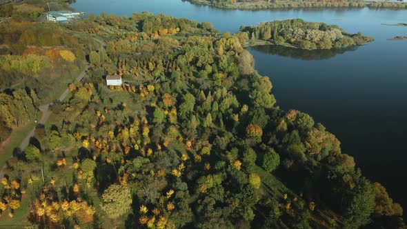 Flight Over The Autumn Park. Trees With Yellow Autumn Leaves Are Visible. alt
