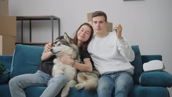 Joyful Woman Hugs Her Dog alt