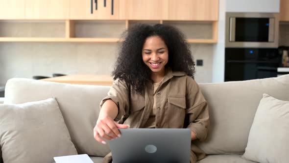 Multiracial Woman Spending Home Leisure with Laptop