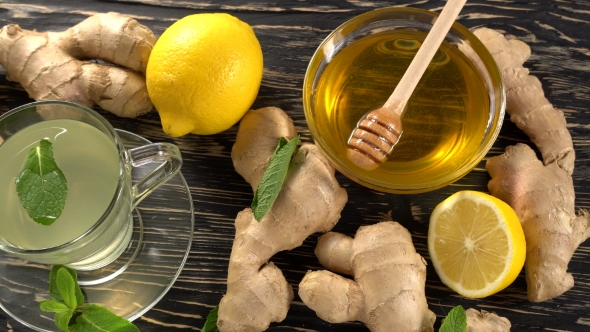 Ginger Tea with Lemon, Mint and Honey on Wooden Background.