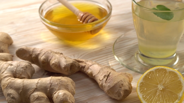 Ginger Tea with Lemon, Mint and Honey on Wooden Background.