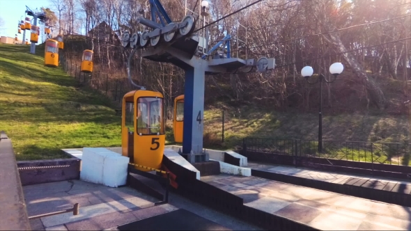 A Small Cable Car on the Hillside with a Blank Yellow Booths in Svetlogorsk, Russia