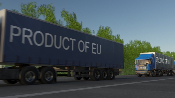 Moving Freight Semi Trucks with PRODUCT OF EU Caption on the Trailer alt