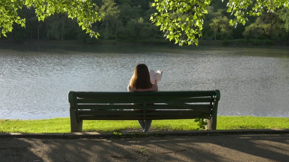 Reading Girl on a Bench in the Park