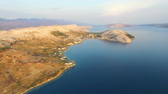 Flying above apartments for tourists on the island of Pag on Dalmatian coast alt
